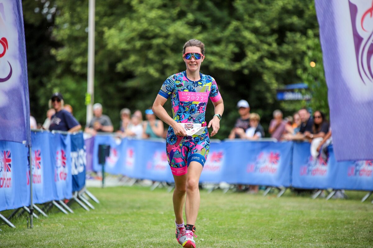 Ellie Perkins running at Ellesmere Lake during the Quarter Ultimate Triathlon